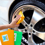 Hand using a folded yellow-orange cloth to wipe a polished car wheel, with stacked Secamax cloths visible in the corner.