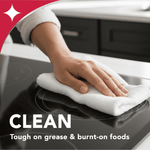 Close-up of a hand wiping a glass cooktop with a white cloth overlaid with 'CLEAN' and 'Tough on grease & burnt-on foods'