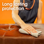 Person wiping a leather surface with a cloth with overlay text ‘Long lasting protection’ on orange background