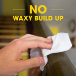 Hand wiping a wood railing with a white pre-moistened wipe and headline text 'No Waxy Build Up'.