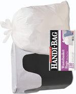 Tied white trash bag placed inside a black wastebasket with Handi-Bag product label inset along the side