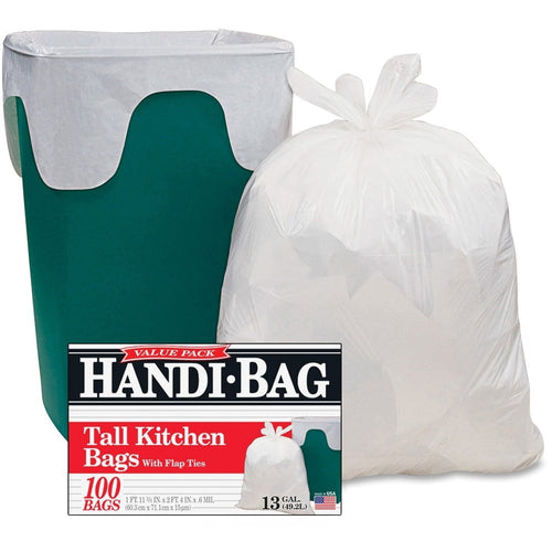 Green trash can fitted with a white Handi-Bag trash liner next to a tied-full white trash bag and product box showing Handi-Bag branding.
