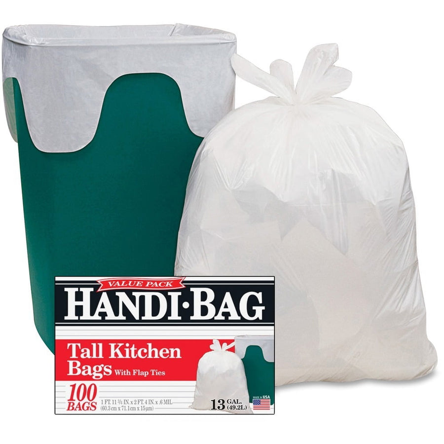 Green trash can fitted with a white Handi-Bag trash liner next to a tied-full white trash bag and product box showing Handi-Bag branding.