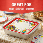 Decorated square birthday cake presented in a Handi-Foil aluminum pan on a table with party napkins and snacks, promotional banner above.