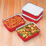 Three red Handi-foil rectangular meal prep pans, two filled with food and two stacked with a board lid on top