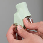 Close view of hands attaching the prongs on a soft sea glass Mainstays fragrance plug
