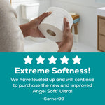 Hands holding an embossed Angel Soft Ultra toilet paper roll in a bathroom, with a testimonial panel below praising softness.