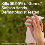 Hands holding a textured sanitizing wipe against a blurred green background with text claiming kills 99.99% of germs