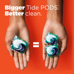 Hands holding Tide Power PODS with text 'Bigger Better Tide PODS: clean' and an equals sign on orange background.