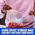 Hands holding a clear Ziploc bag with pink zipper containing sliced red peppers against a neutral background