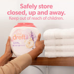 Hands placing a Dreft pacs container on a shelf next to folded white towels with storage safety text above
