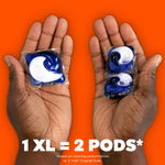 Two hands displaying one large Tide Power POD and two smaller pods on an orange background with '1 XL = 2 PODS' text.