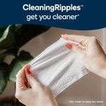 Hands stretching a textured Cottonelle wipe under a banner reading 'CleaningRipples get you cleaner'.