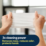 Hands stretching a single white flushable wipe to show texture and strength with feature text overlay