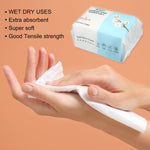 Hands wiping a white disposable towel with inset image of packaged soft face towel and feature text