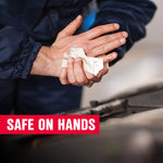Close view of hands using a dirty white wipe on palms near an engine bay with red overlay text stating safe on hands