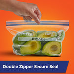 Clear Hefty press-to-close bag filled with halved avocados held by a hand against an orange background.