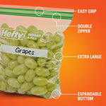 Close-up of a Hefty press-to-close bag filled with grapes highlighting easy grip, double zipper and expandable bottom