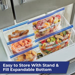 Several Hefty freezer bags inside a freezer drawer containing labeled frozen fruit and prepared meals.