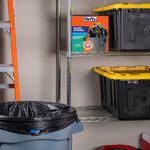 Hefty Ultra Strong product box on a metal shelf with a black trash bag lined trash can and storage bins nearby