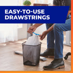 Lifestyle image showing a person tying a Hefty drawstring trash bag in a small office trash can with "easy-to-use drawstrings" banner