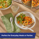 Table setting with quiche on a plate and Hefty ECOSAVE patterned fork and spoon on a napkin, lifestyle image