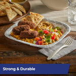 Compostable fork placed next to a takeout tray of falafel, rice and salad on a wooden table highlighting strength and durability