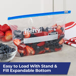 Hefty slider half-gallon bag filled with mixed berries with bowl of blueberries nearby