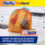 Filled orange Hefty ReNew drawstring bag with blue ties on a kitchen counter next to product box, promotional banner below