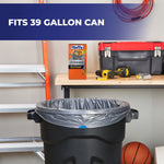 Garage scene with gray Hefty STEELsak box on a workbench and a gray trash bag lining a 39-gallon can