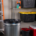 Garage scene with a metal trash can lined with a black Hefty trash bag and a Hefty product box on a shelf