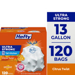 Hefty Ultra Strong orange box showing 13 gallon and 120 bags, with drawstring-tied white trash bag and citrus graphic