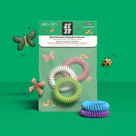 Hello Bello product display with packaged kids mosquito repellent bands and two stacks of coiled colorful wristbands on green background