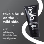 Hello epic whitening activated charcoal toothpaste tube on dark background with text 'take a brush on the wild side' promotional graphic
