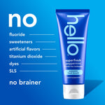 Hello superfresh peppermint toothpaste tube beside a list of ingredients the product contains none of, on a blue background