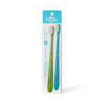 White packaged card showing two hello toothbrushes, green and blue, on a white background with teal header and shadow