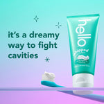 Hello whipped peppermint toothpaste tube standing next to a toothbrush and promotional 'dreamy way to fight cavities' text