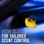Yellow helmet-shaped vent clip attached to a car air vent with overlay text 'VISOR ADJUSTS FOR TAILORED SCENT CONTROL'.