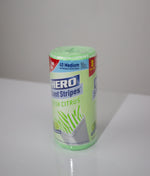 Tilted product shot of a HERO Scent Stripes Fresh Citrus roll standing on a white tabletop