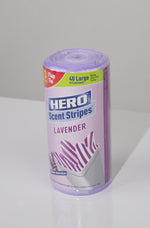 Photograph of a rolled HERO Scent Stripes lavender trash bag package standing upright on a white surface