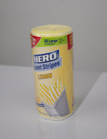 Studio photo of a Hero Scent Stripes lemon roll standing upright on a reflective surface