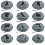 Grid of faux-stone garden plaques showing multiple U.S. state silhouettes with family names beneath each design
