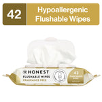 Honest Flushable Wipes gold-gilded package opened with a wipe pulled out, 42 count label visible