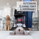 Hoover carpet cleaner in use on floor with person standing behind and a dog sitting in background, text overlay highlights cleaning power