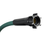 Close-up of black easy-connect female coupling and hose tail showing interior brass thread on a green hose