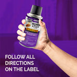 Hand holding a Hot Shot Bedbug & Flea fogger can against a purple background with instruction text visible