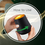 How to use image showing hands demonstrating twisting motion on a small black cordless Air Wick diffuser
