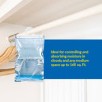 Clear Humydry moisture-absorber hanging bag on a closet rod with blue panel text stating suitability for spaces up to 160 sq. ft.
