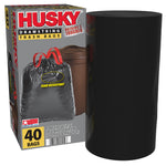 Husky trash bag box shown beside a black roll of trash bags, featuring drawstring bag artwork and 40 bags label