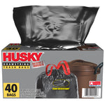 Husky dispenser-style box with a black trash bag pulled out above packaging showing drawstring and 40 bags graphic